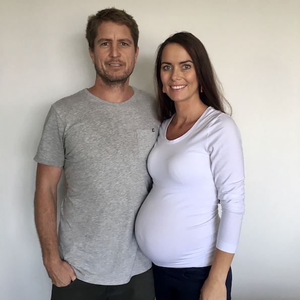 Couple sitting on a couch. Hypnobirthing Australia Course Privately