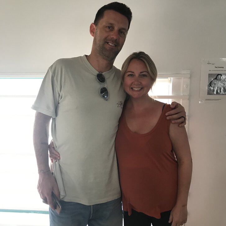 Couple sitting on a couch. Hypnobirthing Australia Course Privately