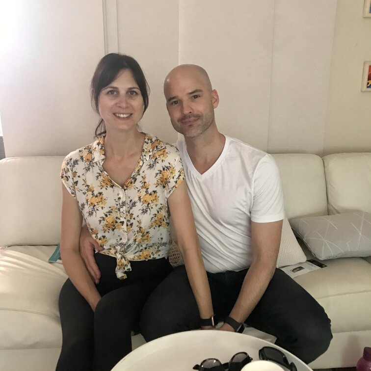 Couple sitting on a couch. Hypnobirthing Australia Course Privately