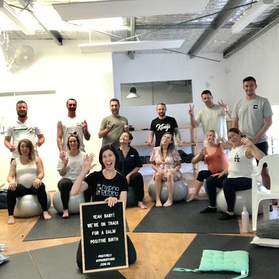 Couples at a Gold coast group hypnobirthing childbirth education course waving at the camera