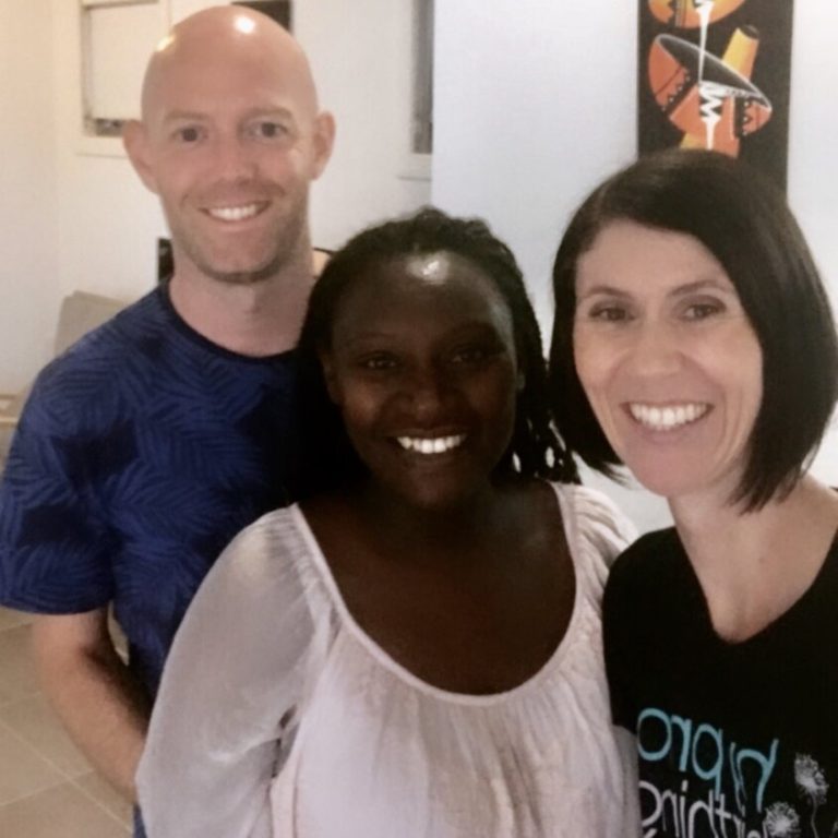 Pregnant couple and Kate hypnobirthing practitioner smiling after hypnobirthing class