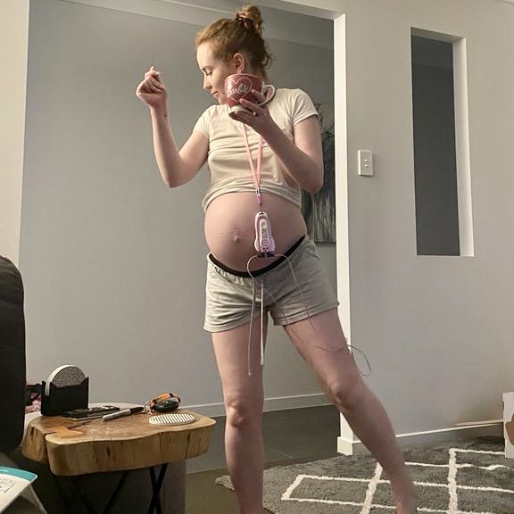 Pregnant mum dancing in labour at home with tens machine on