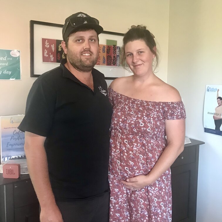 Couple sitting on a couch. Hypnobirthing Australia Course Privately