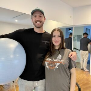 Pregnant couple holding birth ball after doing hypnobirthing class