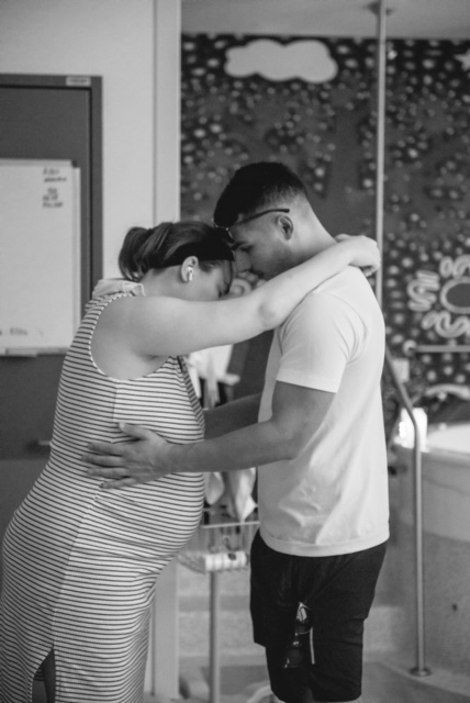 pregnant couple doing slow dance technique to relax mum