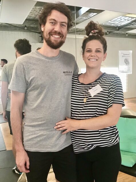Pregnant couple smiling after doing Positively Hypnobirthing Group Course on the Gold Coast