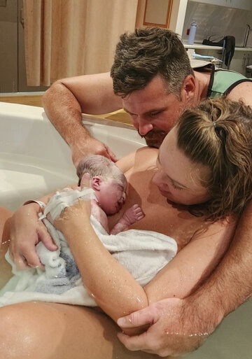 Laura and partner meeting baby for first time