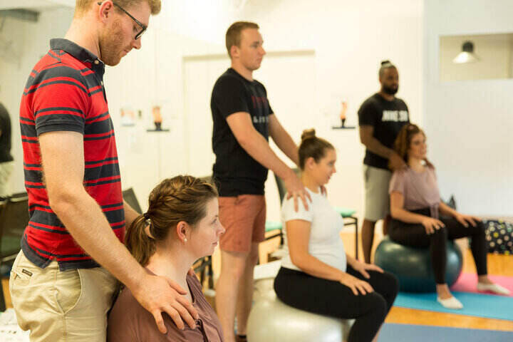 Couple doing light touch massage hypnobirthing techniques Gold Coast Childbirth Education Class