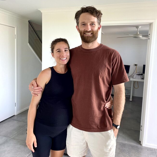 Couple sitting on a couch. Hypnobirthing Australia Course Privately