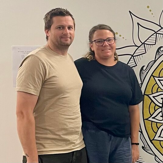 Pregnant couple smiling after completing Hypnobirthing Australia™ course on the Gold Coast with Positively Hypnobirthing