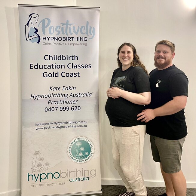 Couple sitting on a couch. Hypnobirthing Australia Course Privately