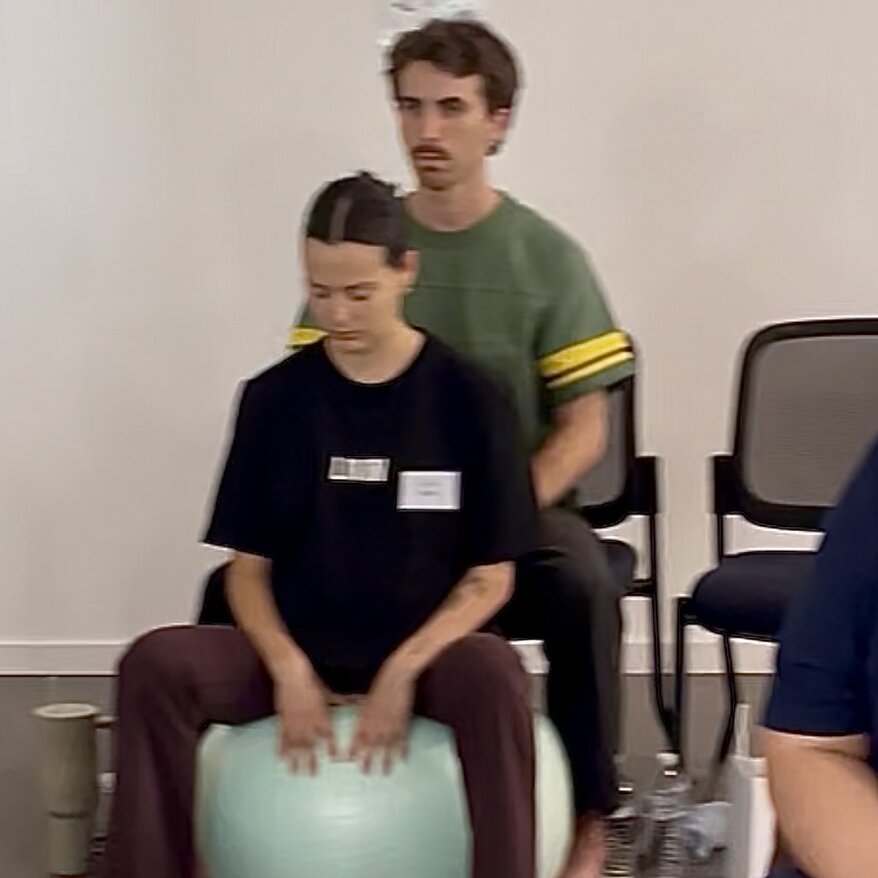Caitlin practising hypnobirthing techniques in group Positively Hypnobirthing course