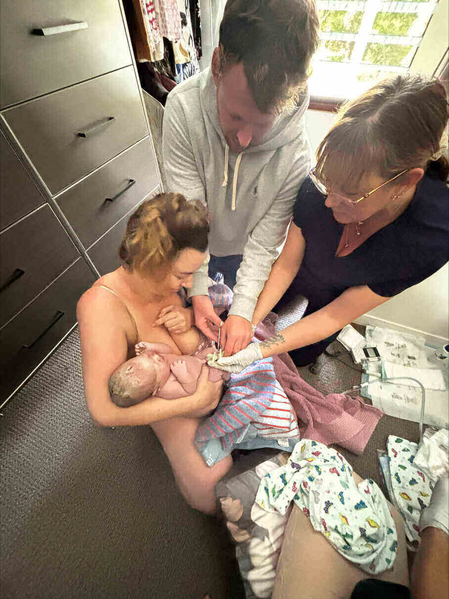 Dad holding newborn baby