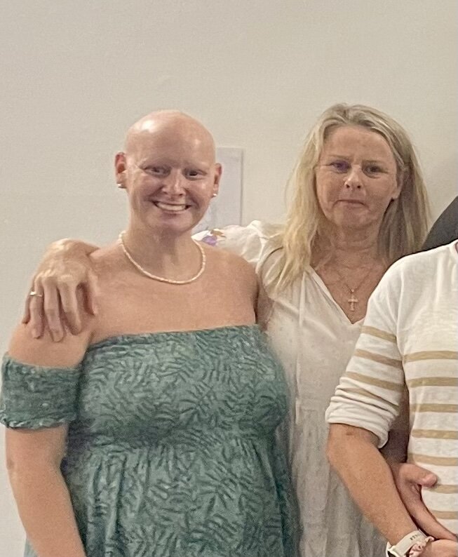 Pregnant Jess smiling with her mum by her side at a Hypnobirthing Australia course on the Gold Coast