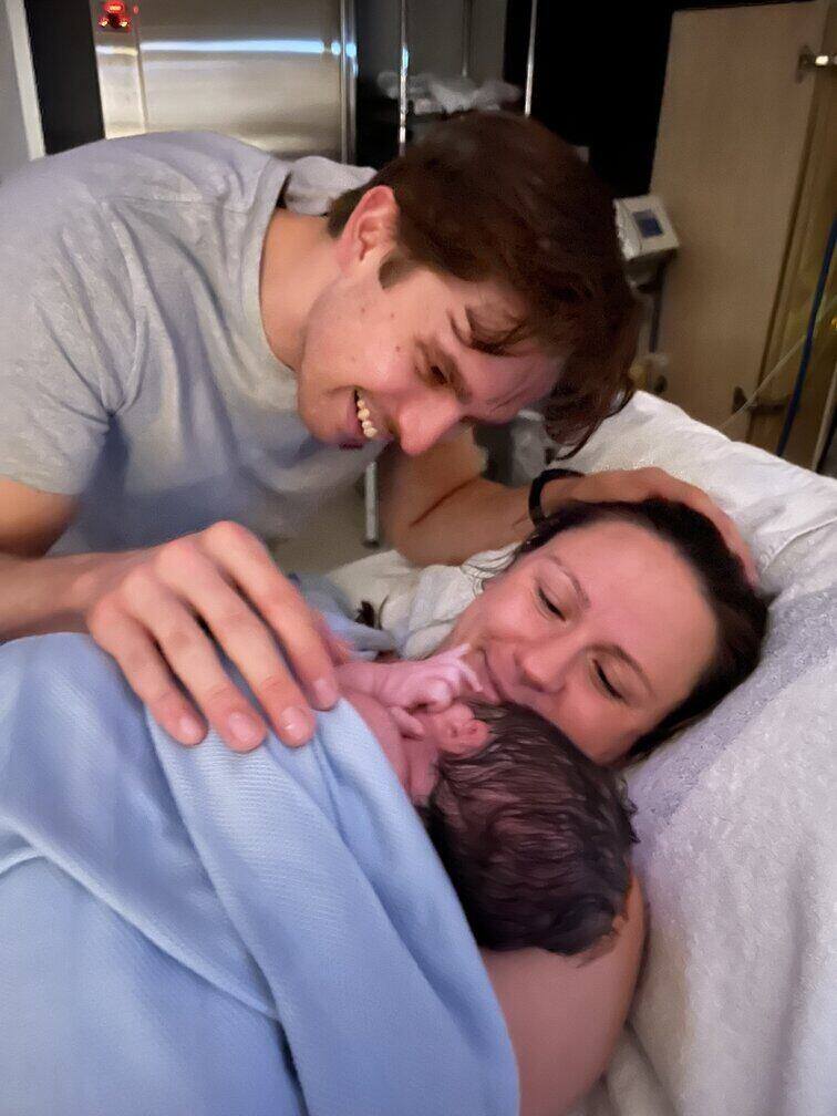 Dad holding newborn baby